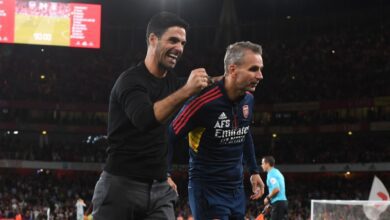 Arsenal manager Mikel Arteta and 1st team coach Albert Stuivenburg celebrate after the Premier League match between Arsenal FC and Aston Villa at Emirates Stadium on August 31, 2022 in London, England.