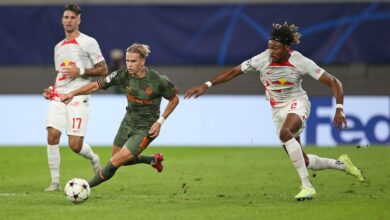 Mykhaylo Mudryk of Shakhtar Donetsk is challenged by Mohamed Simakan of RB Leipzig during the UEFA Champions League group F match between RB Leipzig and Shakhtar Donetsk at Red Bull Arena on September 06, 2022 in Leipzig, Germany.