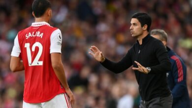 Arsenal manager Mikel Arteta speaks to William Saliba during the Premier League match between Arsenal FC and Liverpool FC at Emirates Stadium on October 09, 2022 in London, England.