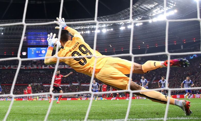 Manchester United target Diogo Costa of FC Porto saves a penalty kick from Kerem Demirbay (obscured) of Bayer Leverkusen during the UEFA Champions League group B match between Bayer 04 Leverkusen and FC Porto at BayArena on October 12, 2022 in Leverkusen, Germany.