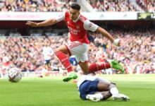 Arsenal star Gabriel Martinelli jumps the challenge from Emerson Royal of Tottenham during the Premier League match between Arsenal FC and Tottenham Hotspur at Emirates Stadium on October 01, 2022 in London, England.