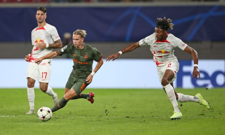 Mykhaylo Mudryk of Shakhtar Donetsk is challenged by Mohamed Simakan of RB Leipzig during the UEFA Champions League group F match between RB Leipzig and Shakhtar Donetsk at Red Bull Arena on September 06, 2022 in Leipzig, Germany.