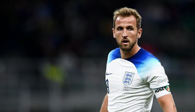 Harry Kane in action for England against Italy and wearing the One Love armband.