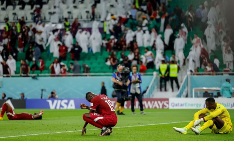 Almoez Ali of Qatar and goalkeeper Meshaal Barsham of Qatar look dejected after the FIFA World Cup Qatar 2022 Group A match between Qatar and Senegal at Al Thumama Stadium on November 25, 2022 in Doha, Qatar.