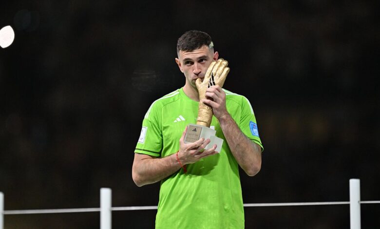 Manchester United target Emiliano Martinez of Argentina receives Golden Glove prize during an award ceremony held after Argentina beat France with penalty shootout to win 2022 FIFA World Cup at Lusail Stadium on December 18, 2022 in Lusail City, Qatar.