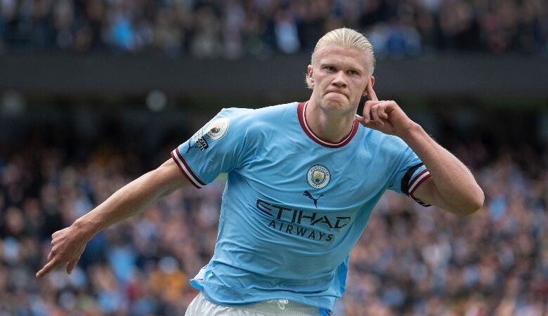 Erling Haaland celebrates after scoring for Manchester City against Manchester United..