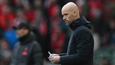 Manchester United manager Erik ten Hag makes notes during the English Premier League football match between Liverpool and Manchester United at Anfield in Liverpool, north west England on March 5, 2023.