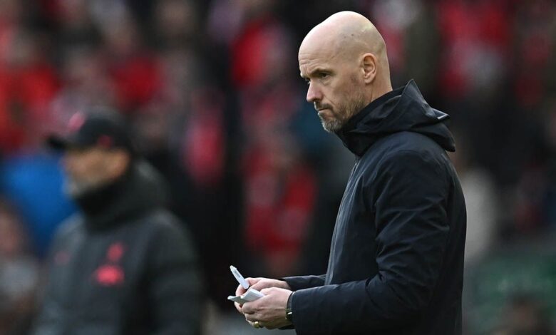 Manchester United manager Erik ten Hag makes notes during the English Premier League football match between Liverpool and Manchester United at Anfield in Liverpool, north west England on March 5, 2023.