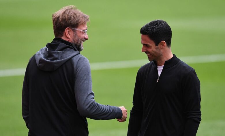 Liverpool and Arsenal managers Mikel Arteta and Jurgen Klopp share a moment before the Premier League match between Arsenal FC and Liverpool FC at Emirates Stadium on July 15, 2020 in London, England. Football Stadiums around Europe remain empty due to the Coronavirus Pandemic as Government social distancing laws prohibit fans inside venues resulting in all fixtures being played behind closed doors.