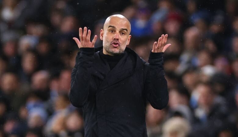 Manchester City manager Pep Guardiola on the touchline against Manchester United