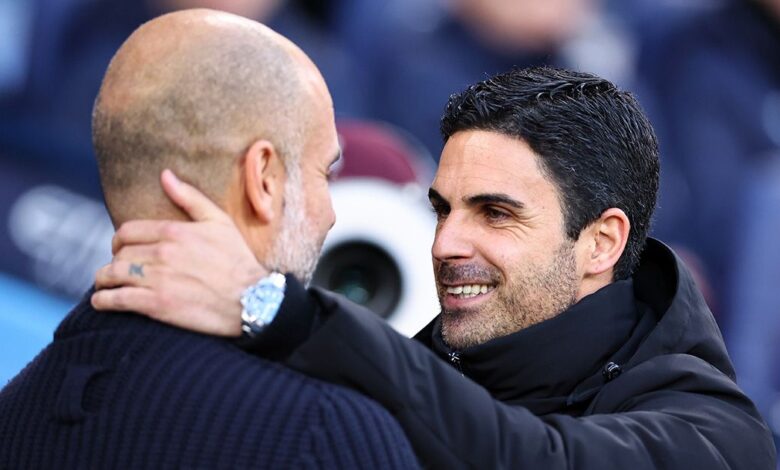 Manchester City and Arsenal managers Pep Guardiola and Mikel Arteta respectively embrace during the Premier League match between Manchester City and Arsenal FC at Etihad Stadium on April 26, 2023 in Manchester, United Kingdom.