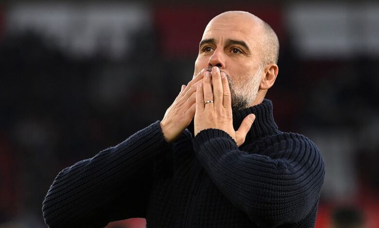 Manchester City manager Pep Guardiola acknowledges the fans after the team